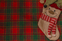red and green plaid and Christmas stocking 