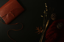 leather bound journal, fall foliage, and knit scarf 