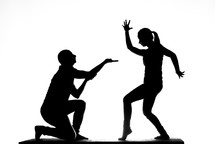silhouettes of theater performers on stage 