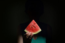 Woman Holding Slice Of A Red Watermelon in Studio