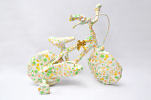 Fun Secret Gift. Bike with Wheels In Playful Gift Wrap