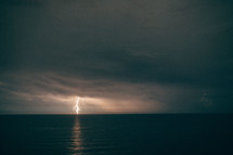 A bolt of lightning striking over the Atlantic Ocean