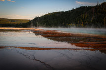 steam rising over a lake 