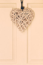basket weave heart hanging on a door 