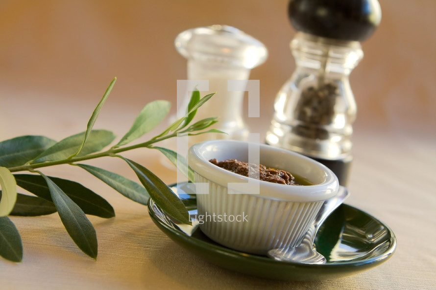 olive dip with leaves