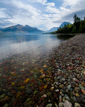 pebbles and rocks along a lake shore beach