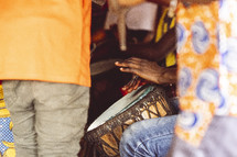 Christian African people playing the drums, singing and dancing in a small village church in the Ivory Coast in west Africa