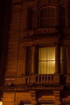 light on in a townhouse window