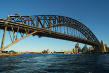 Sydney Harbor Bridge with the Opera House and Sydney Central Business District in the background.