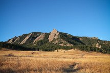 mountain peak  and open field