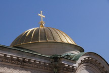 A church with a dome and cross on the top
