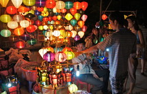 People shopping for Chinese paper lanterns