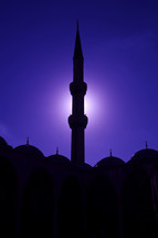 silhouette of a tower on a mosque