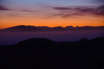 Misty mountain range at dusk