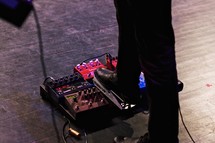 foot on guitar pedals