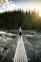 swinging bridge over a river 