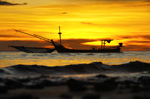 Fishing boats on the sea at sunset