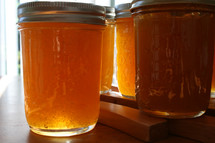 preserves and honey in mason jars 