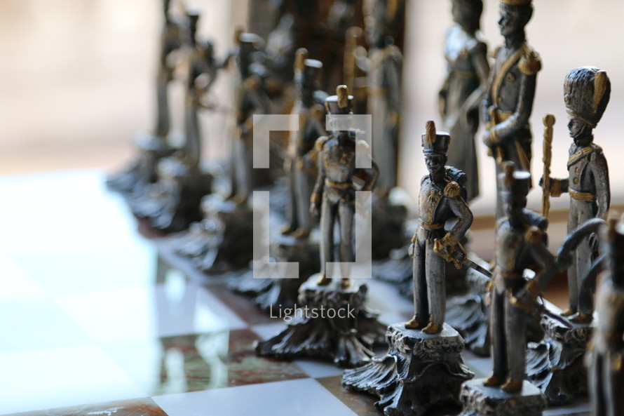 pewter chess pieces of soldiers 