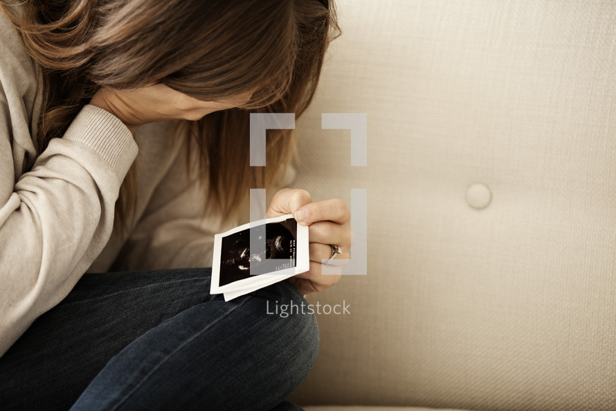 mother looking at an ultrasound 