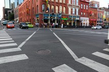 crosswalks and traffic in a downtown street 