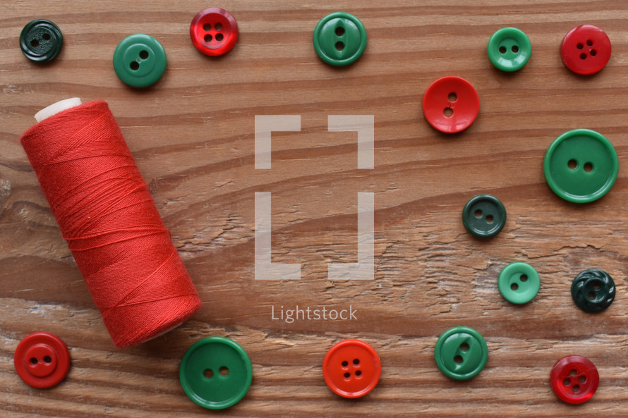 red and green buttons and thread 