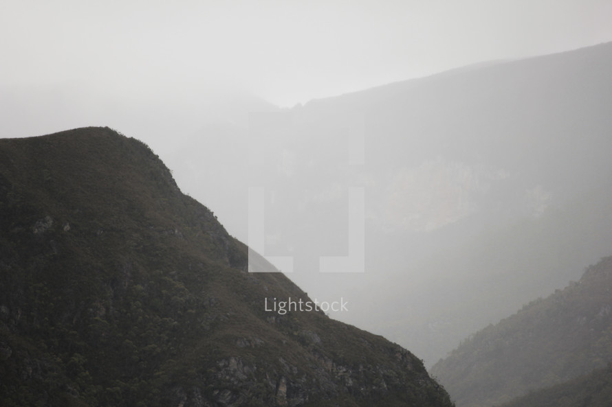 mountains in fog 