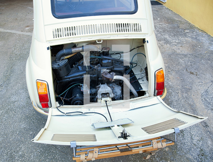 Florence, Italy - January 12, 2012: Fiat 500 was one of the most produced European cars. Rear view with visible engine.