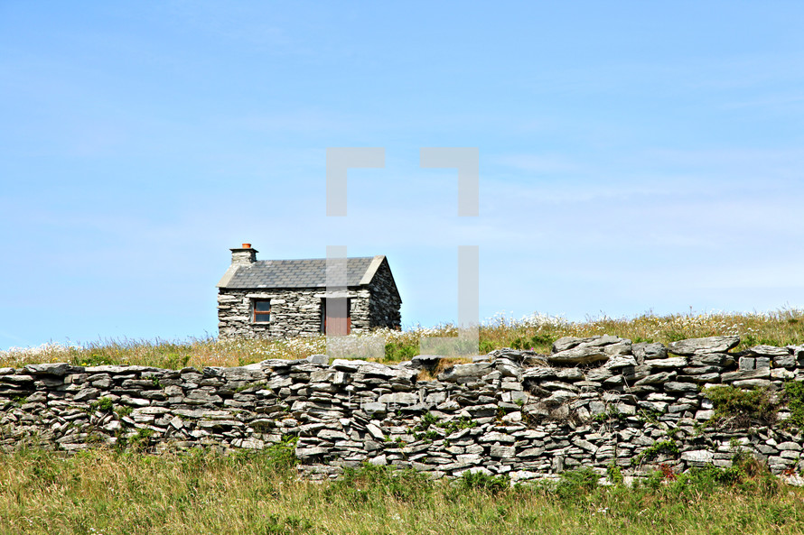 stone cabin and stacked stone fence