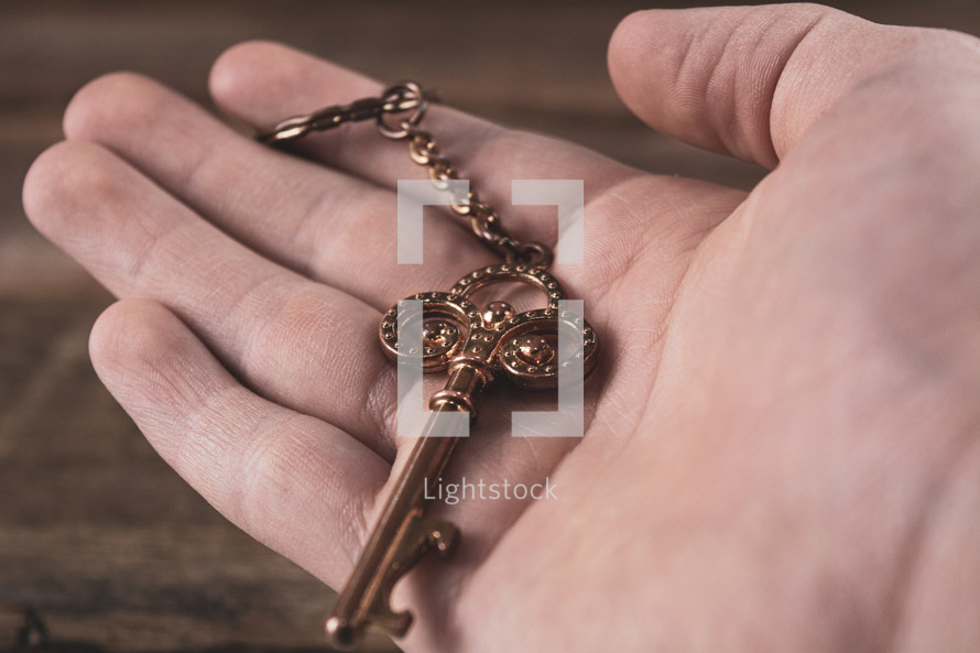 golden key in a hand 