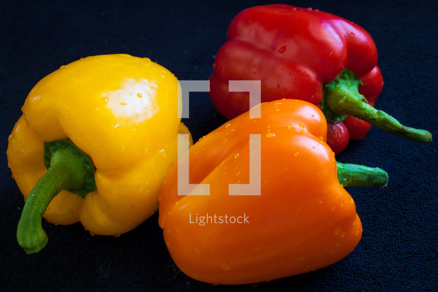 red, yellow, and orange bell peppers 