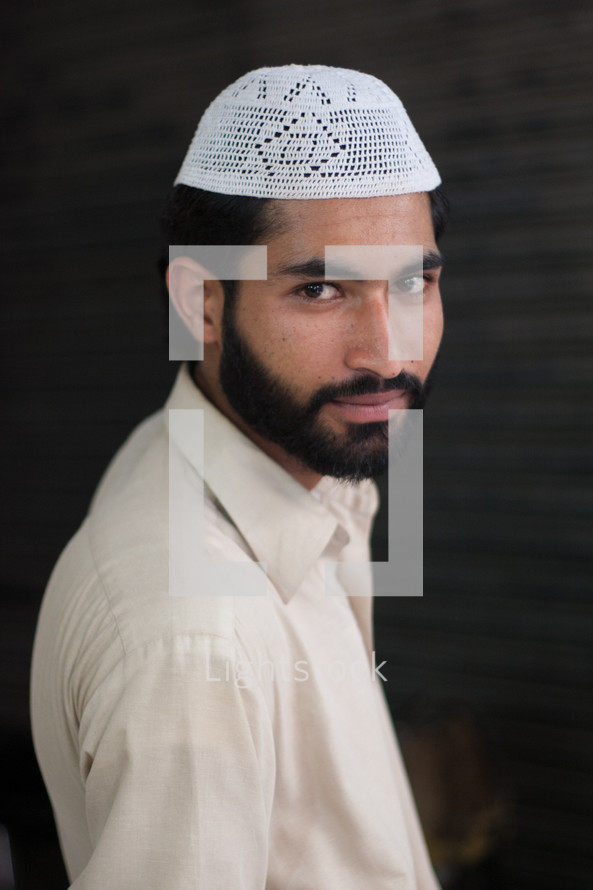 muslim wearing hat