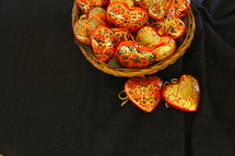 basket of heart shaped hand made wooden ornaments