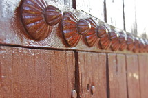 decorative metal buttons on a door in India 