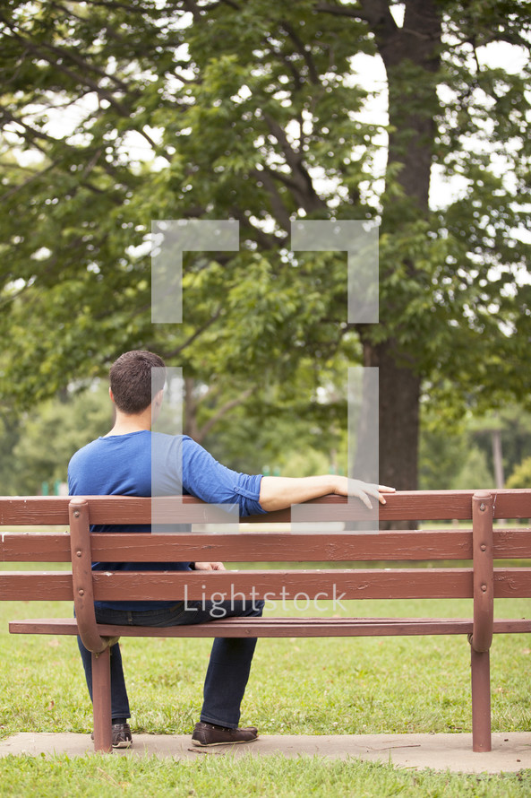 Man sitting on a park bench.