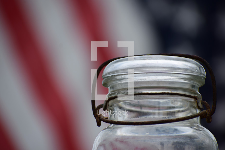 empty jar and American flag 