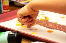 child finger-painting 