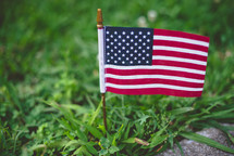 American flag in grass 