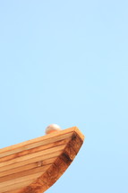 wood boards against a blue sky 