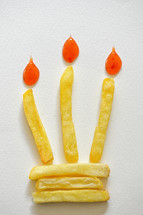 Abstract Birthday Cake With Burning French Fries Candle