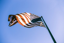 American flag waving on a flag pole 