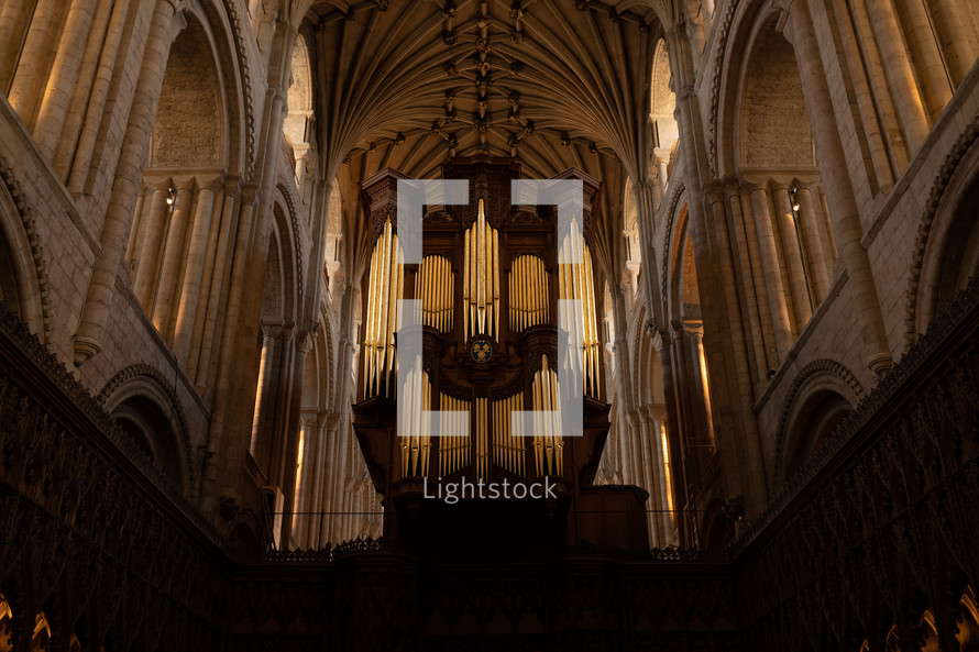 Church organ inside Norwich Cathedral, large pipe organ, beautiful religious architecture