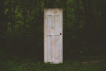 old door in a forest 