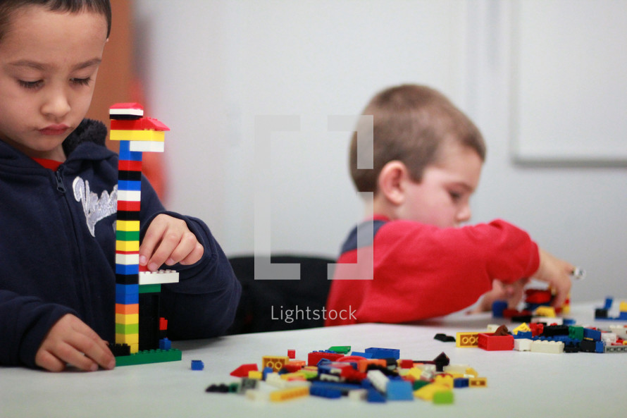 Boy playing with legos.