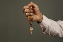 hand holding a rosary 
