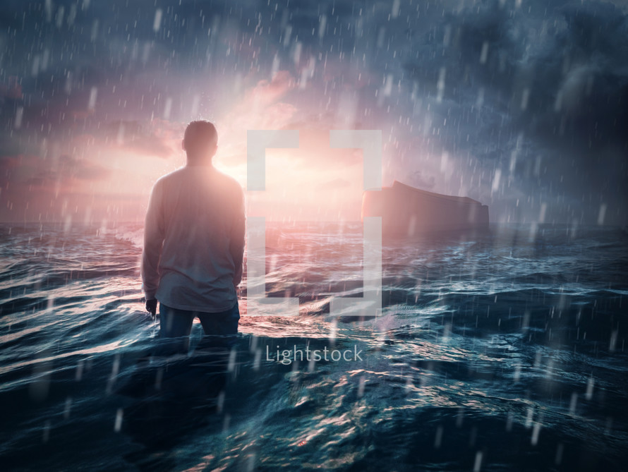 A man stands in deep water as the ark is too far away