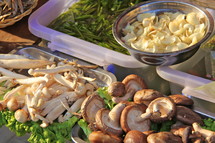 Mushrooms in trays on sale at a local wet market