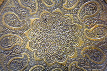 decorative gold and blue pattern in metal 