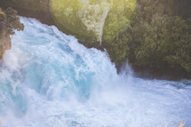 water rushing down a waterfall 