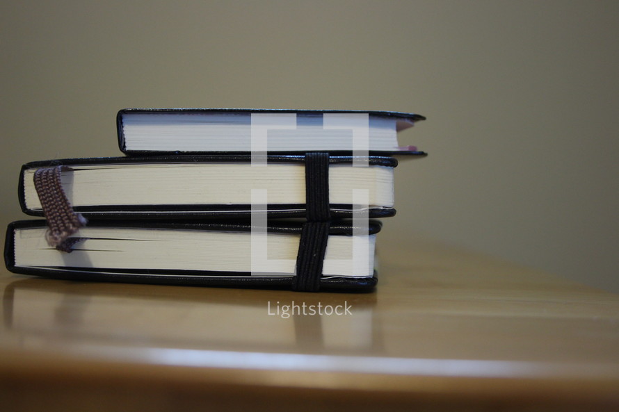 stacked books and journals 
